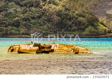 old rusty shipwreck at the shores of Isla Grande near Portobelo in Panama 135029371