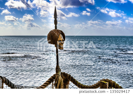 Human skull over spear as the decoration on the deck. 135029417