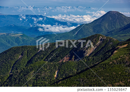 Mount Tateshina seen from Mount Io in the Yatsugatake Mountain Range and the remaining snow on the Hakuba and Ushiro-Tateyama Mountain Ranges Mount Tateshina seen from Mount Io in the Yatsugatake Mountain Range and the remaining snow on the Hakuba and Ushiro-Tateyama Mountain Ranges 135029847