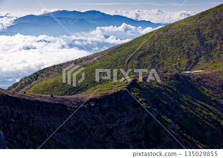 A mountain hut on the Iodake ridge of the Yatsugatake mountain range and Mount Kinpu in Okuchichibu above the clouds A mountain hut on the Iodake ridge of the Yatsugatake mountain range and Mount Kinpu in Okuchichibu above the clouds 135029855