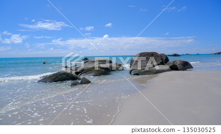 Scenic Sungailiat Coastline with Large Granite Boulders and Gentle Ocean Waves Scenic Sungailiat Coastline with Large Granite Boulders and Gentle Ocean Waves 135030525