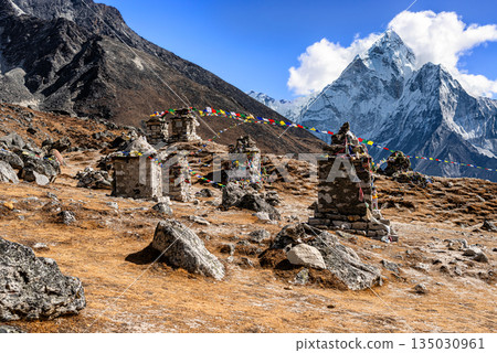 The memorial place on Everest Base Camp trek outside the village of Dughla in Nepal. 135030961