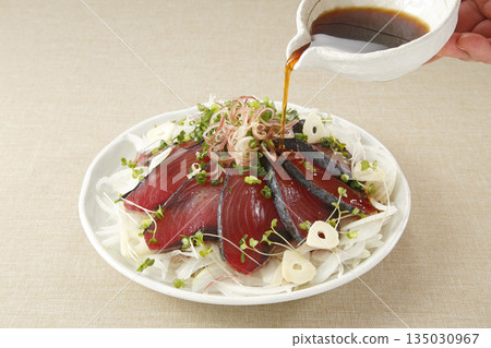 Topped with seared bonito and ponzu sauce Topped with seared bonito and ponzu sauce 135030967
