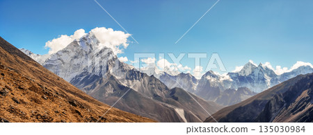 Scenic valley and Himalayan mountains peaks on trek between Tengboche and Lobuche, Nepal. Scenic valley and Himalayan mountains peaks on trek between Tengboche and Lobuche, Nepal. 135030984