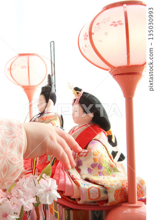 Baby's hand gently touching the Hina dolls, curious about them_Vertical 135030993