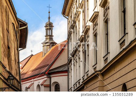 Houses and church roof in old town district of Cracow in Poland Houses and church roof in old town district of Cracow in Poland 135031289