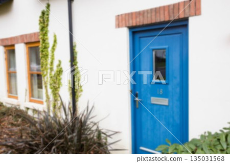 Closed blue door of white house Closed blue door of white house 135031568