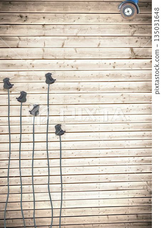 Plugs on wooden background Plugs on wooden background 135031648