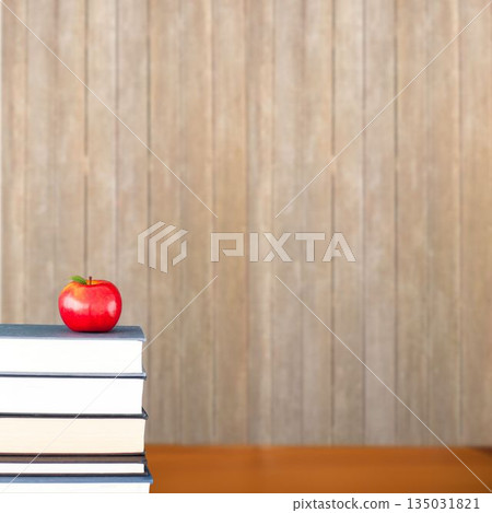 Red apple on pile of books Red apple on pile of books 135031821