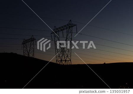 The evening electricity pylon silhouette The evening electricity pylon silhouette 135031957
