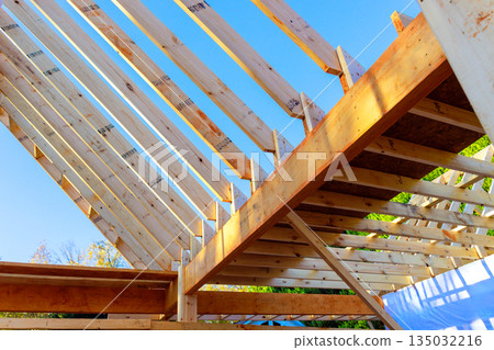 Wooden truss are being assembled for beams joists roof n construction site 135032216