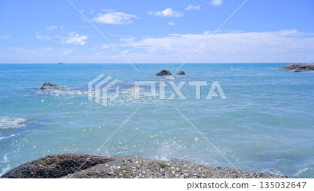 Sunlight Reflecting on Crystal Clear Sea Water with Granite Rocks 135032647