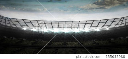 3D render is showing curved metal roof truss and shining floodlights above tiered stadium seating 3D render is showing curved metal roof truss and shining floodlights above tiered stadium seating 135032988