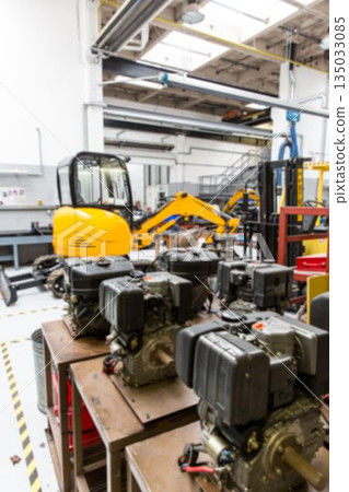 Yellow excavator is standing in flat design workshop scene showing wooden benches and engines Yellow excavator is standing in flat design workshop scene showing wooden benches and engines 135033085