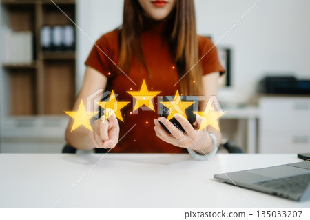 Customer or client the stars to complete five stars. with copy space. giving a five star rating. Service rating, satisfaction Customer or client the stars to complete five stars. with copy space. giving a five star rating. Service rating, satisfaction 135033207