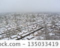 Snow covered neighborhood seen from above during winter afternoon 135033419