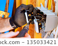 Working on electrical circuit installation in residential space 135033421