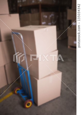 Stack of cardboard boxes in warehouse 135034342