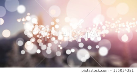Defocused lights against snow covered mountains Defocused lights against snow covered mountains 135034381