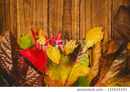Wooden table with autumn leaves Wooden table with autumn leaves 135034383