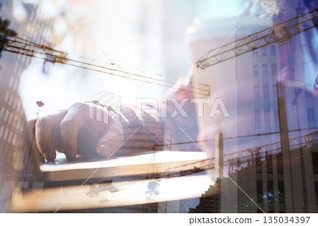 Businesswoman using laptop in office Businesswoman using laptop in office 135034397