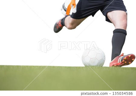 Soccer player legs are kicking white ball in flat design, on green grass with white backdrop 135034586
