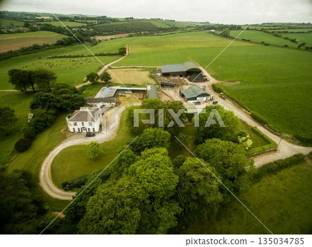 Aeriel view of house on green landscape 135034785
