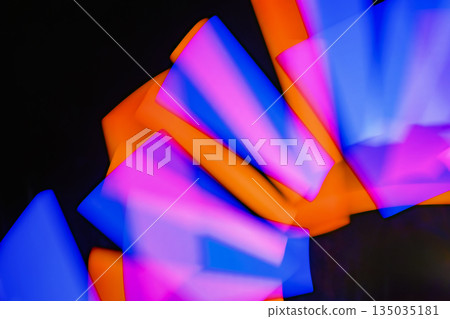 Abstract image of light painting with blur effect. Colorful vibrant lights are swirling in the dark background. It can be used as wallpaper, background or design element 135035181