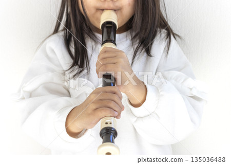 A 5-year-old girl plays the recorder (faceless, Japanese) A 5-year-old girl plays the recorder (faceless, Japanese) 135036488