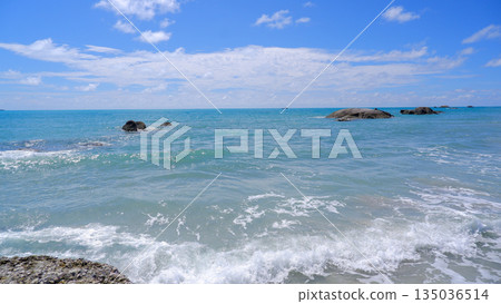 Wide Blue Ocean Horizon with Scattered Granite Rocks and White Clouds at Sungailiat Wide Blue Ocean Horizon with Scattered Granite Rocks and White Clouds at Sungailiat 135036514