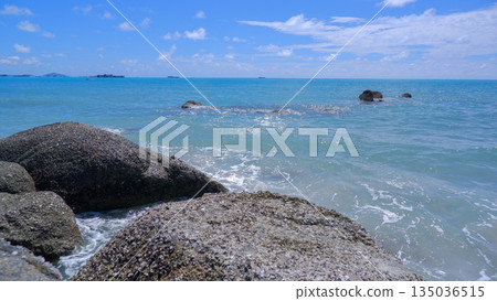 Crystal Clear Turquoise Water Rippling over Granite Rocks at Bangka Island Beach Crystal Clear Turquoise Water Rippling over Granite Rocks at Bangka Island Beach 135036515