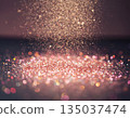 Falling Rose Gold Glitter Dust with Sparkling Bokeh Background 135037474