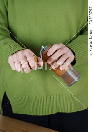 Grind coffee beans Grind coffee beans 135037934