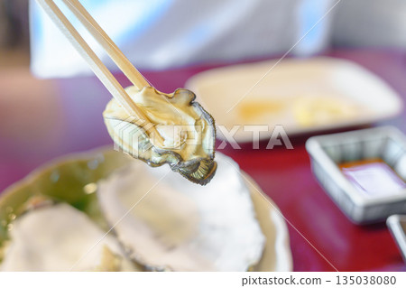 grilled Oyster in Matsushima fish market, seafood famous and popular of Matsushima bay in Miyagi Prefecture, Tohoku, Japan grilled Oyster in Matsushima fish market, seafood famous and popular of Matsushima bay in Miyagi Prefecture, Tohoku, Japan 135038080
