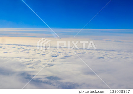 Beautiful white clouds in blue sky. View from airplane 135038537