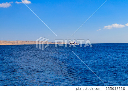 White yacht sailing in Red sea, Egypt White yacht sailing in Red sea, Egypt 135038538