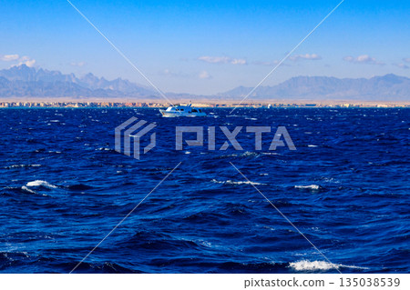 White yacht sailing in Red sea, Egypt White yacht sailing in Red sea, Egypt 135038539
