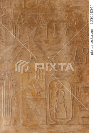Ancient egyptian hieroglyphs carved on the stone wall Ancient egyptian hieroglyphs carved on the stone wall 135038544