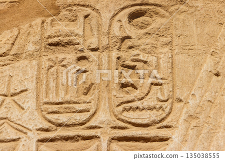 Ancient egyptian hieroglyphs on the wall in Karnak Temple Complex in Luxor, Egypt Ancient egyptian hieroglyphs on the wall in Karnak Temple Complex in Luxor, Egypt 135038555