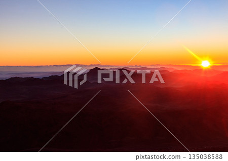 Beautiful sunrise on a top of Mount Sinai (Moses Mount) in Egypt 135038588