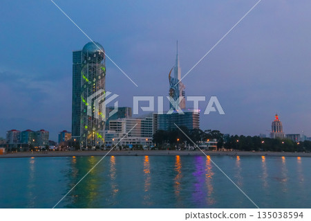 Batumi, Adjara, Georgia. View from the sea on illuminated resort town at evening Batumi, Adjara, Georgia. View from the sea on illuminated resort town at evening 135038594