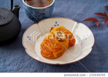 Dried persimmon tea cake and Japanese tea Dried persimmon tea cake and Japanese tea 135038705
