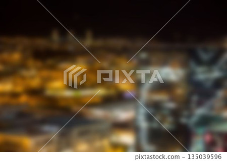 Illuminated crowded buildings in city 135039596