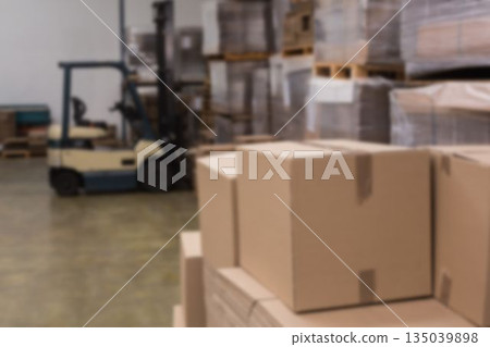 Forklift and cardboard boxes in warehouse 135039898