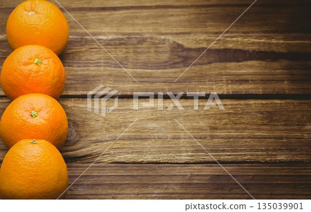 Overhead view of oranges on wooden table 135039901