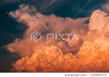Dramatic orange sunset clouds and stormy sky 135040374