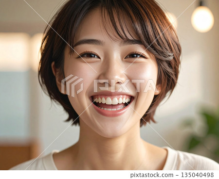 A young woman with a big smile 135040498