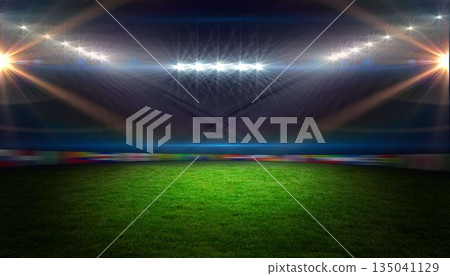 Empty grass pitch is being shown in flat style stadium with floodlight flares and banner ads Empty grass pitch is being shown in flat style stadium with floodlight flares and banner ads 135041129
