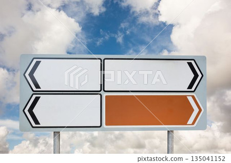 Blank sign posts against cloudy sky 135041152