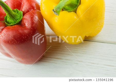 Fresh bell peppers on chopping board Fresh bell peppers on chopping board 135041196